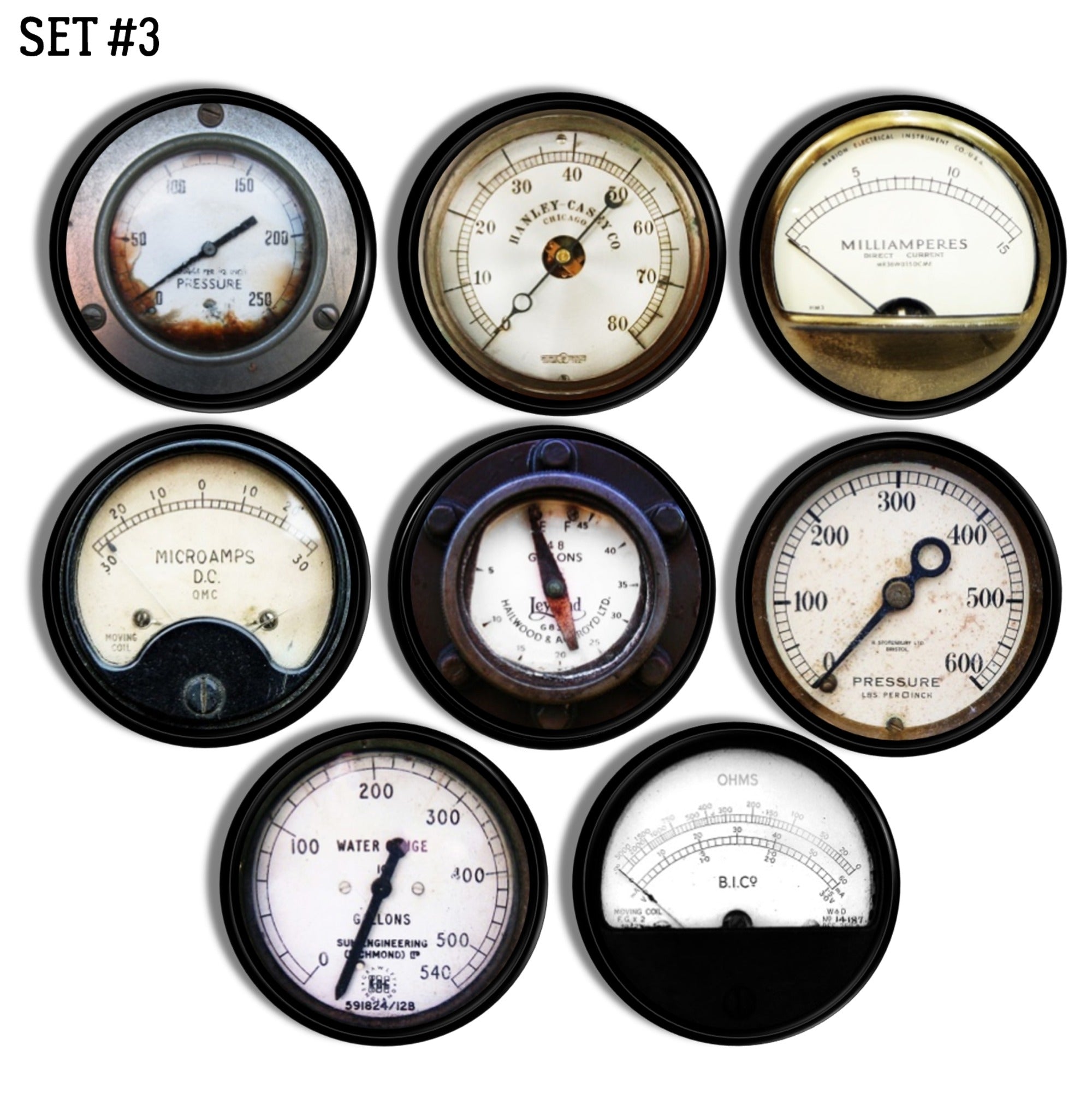 Vintage cabinet knobs in an 8‑piece set featuring industrial gauge prints for pressure, ohms, and water volume.