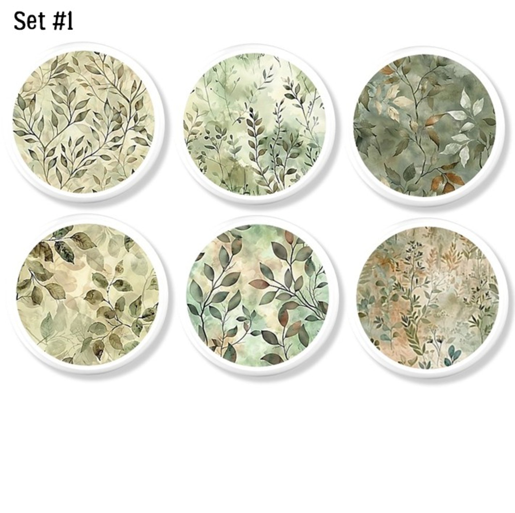 Six soft watercolor leaf cabinet knobs with airy sage and beige botanical artwork on a white base knob.