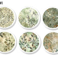 Six soft watercolor leaf cabinet knobs with airy sage and beige botanical artwork on a white base knob.