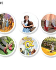 Wizard of Oz cabinet knobs with Dorothy, Toto, ruby slippers, Wicked Witch, and title graphic on white base knob