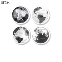4 black and white globe map cabinet knobs. Modern minimalist hardware for clean contemporary home decor.