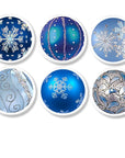 Six blue and white Christmas ornament inspired cabinet knobs with peaceful winter designs in silver and white, featuring snowflakes, swirls, and festive holiday patterns on soft blue backgrounds.