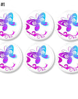 6 Tattoo style butterfly design dresser drawer pulls in vibrant fuchsia, blue and purple on white knobs. Cabinet knobs for a young girl's bedroom or bathroom update.
