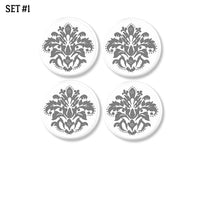 4 Handmade decorative dresser drawer knobs with medium gray floral damask on white drawer pull.