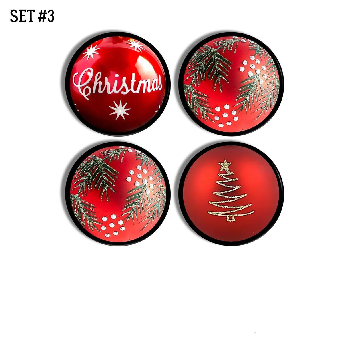 Four‑piece holiday ornament cabinet knob set in red featuring a coordinated mix of Christmas designs including pine greenery, gold tree art, festive script, and snowy seasonal accents for bright winter cabinet décor