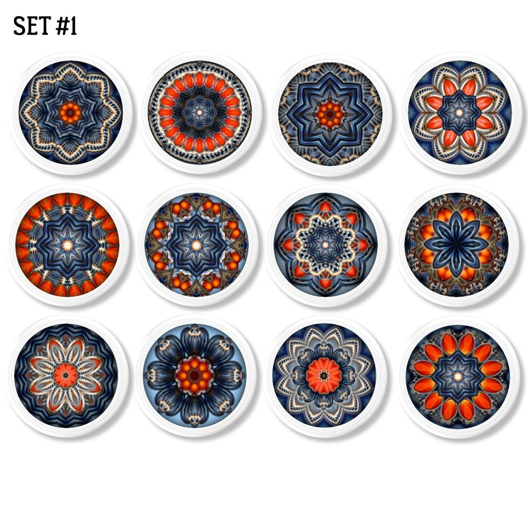 Twelve handcrafted cabinet knobs featuring intricate mandala designs inspired by starburst quilts — each with a unique kaleidoscope pattern in vibrant blue, red-orange, and beige tones. Ideal for expressive drawer pulls in Boho, Cottagecore, or eclectic home décor.