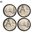 4 Beige on black cabinet door knobs in a Paris France historical landmark theme featuring the Eiffel Tower, Cathedral and river boats along the River Seine.