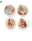 Four handmade cabinet knobs featuring sweet Beatrix Potter rabbit family scenes and character portraits in soft pastel storybook watercolor style.
