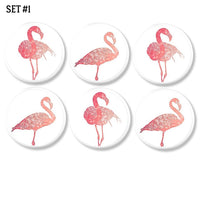 6 Pink flamingo art decorative cabinet knobs. in various hues of salmon and coral on a white drawer pull for a subtle tropical accent.