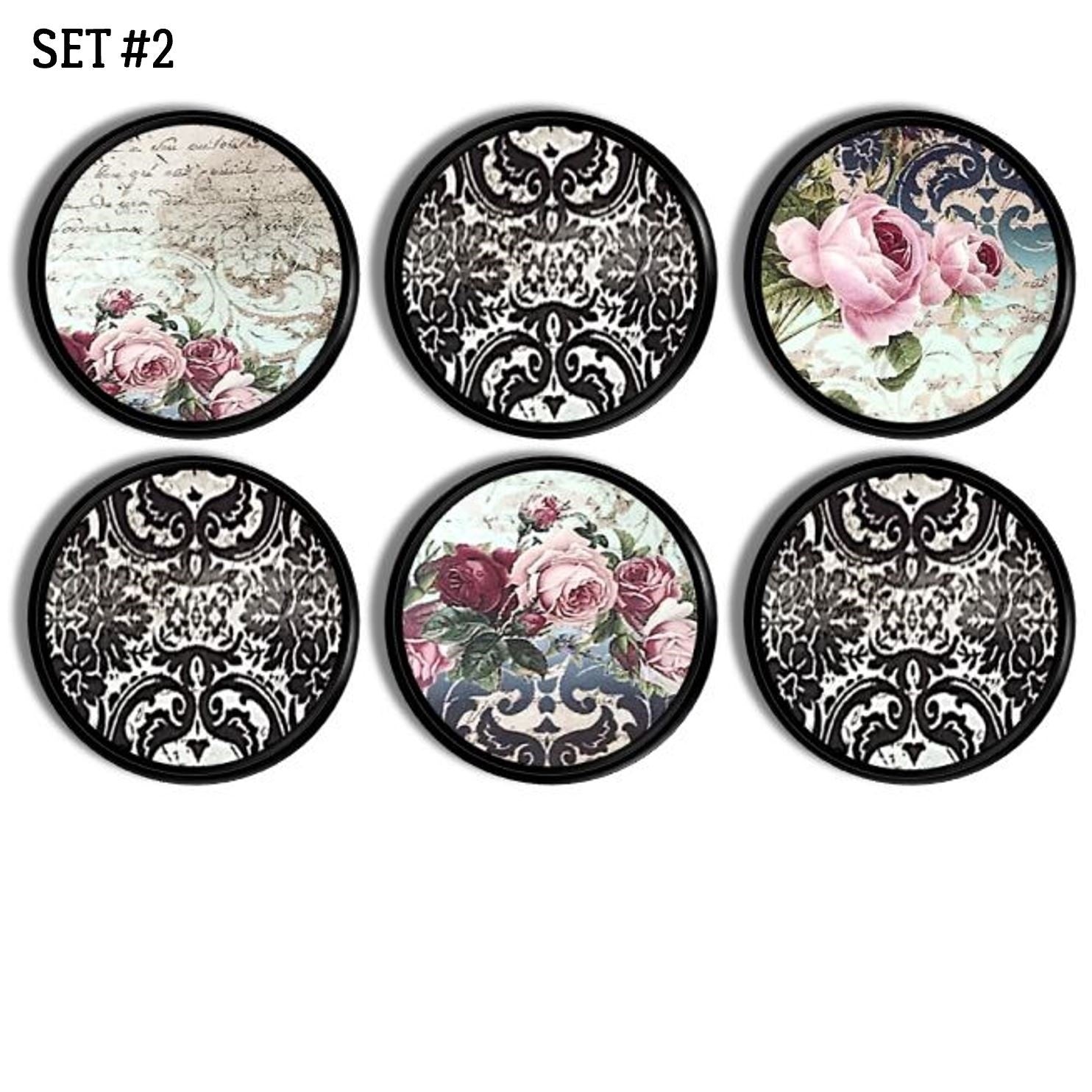 Six handcrafted cabinet knobs featuring pink rose florals mixed with black damask patterns and ornate vintage backgrounds, ideal for gothic baroque, Victorian, or Parisian-inspired décor.