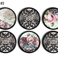 Six handcrafted cabinet knobs featuring pink rose florals mixed with black damask patterns and ornate vintage backgrounds, ideal for gothic baroque, Victorian, or Parisian-inspired décor.