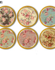 Natural wood cabinet knobs in shabby cottage floral patterns. Muted heirloom colors to compliment antique furniture decor.