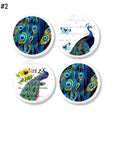 4 Furniture door pulls decorated with peacock and feathers with butterfly and sunflower on french postcard. Colors are deep blue, turquoise and yellow.