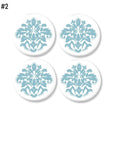 4 Bathroom cabinet door knobs decorated with turquoise blue and white lotus floral damask print.