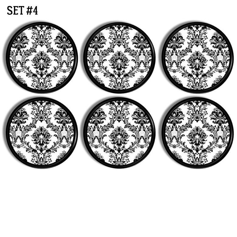 Sexy steampunk Victorian bathroom cabinet drawer pulls in black and white wallpaper print.